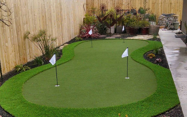 Artificial grass putting greens in a landscaped Palo Alto backyard