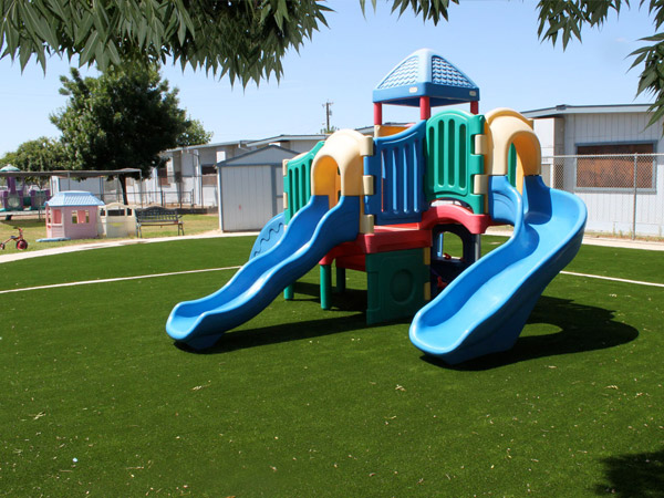 Playground equipment on artificial grass