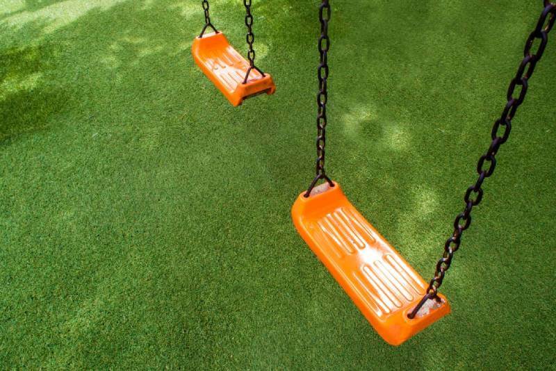 Swingset installed on artificial grass