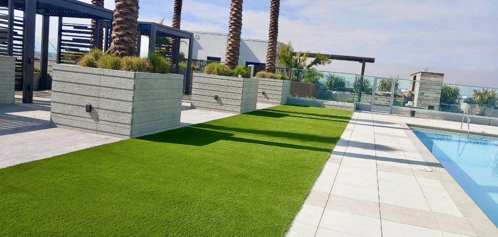 Artificial grass backyard with pool