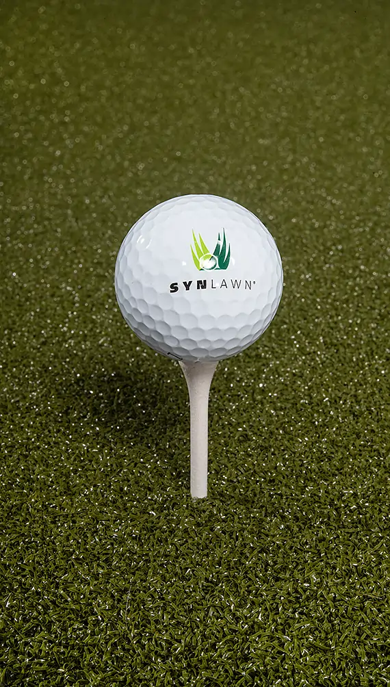 Golf ball teed up on artificial grass from SYNLawn